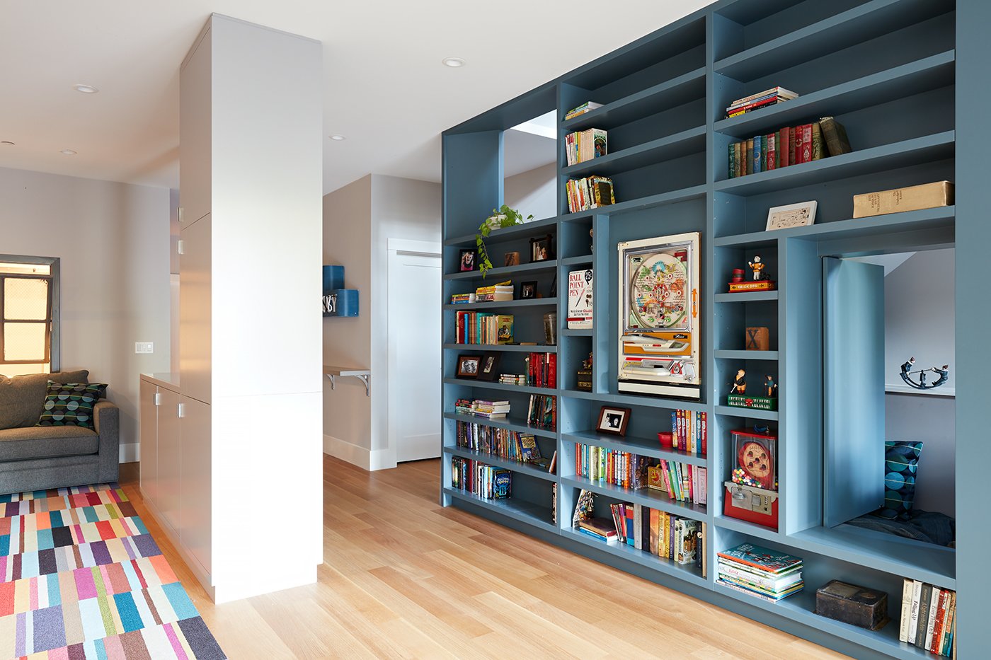 on-the-basement-level-the-megacabinet-shelving-is-mainly-used-for-books-and-toys-the-floors-throughout-the-home-are-engineered-white-oak